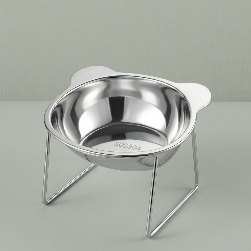 The tilted stainless steel cat bowl on its wire stand, on a plain background.