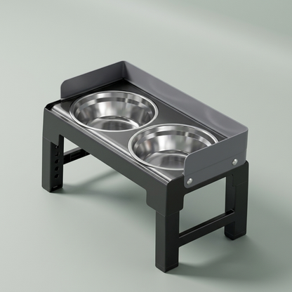 The black folding raised feeder with two stainless steel bowls, on a plain background.