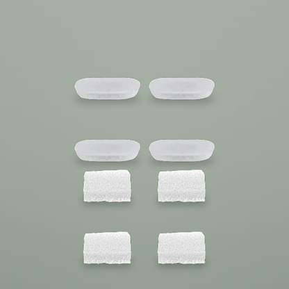 Four carbon filter pads and four foam pre-filters on a plain background.
