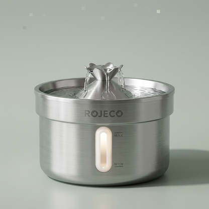 The stainless steel pet fountain alone on a plain background, water running from the centre spout.