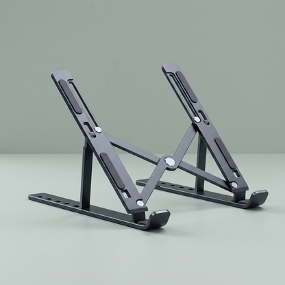 The folding aluminium laptop stand, open, on a plain background.